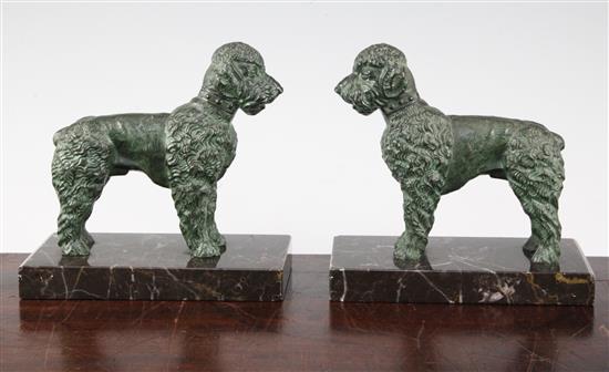 A pair of French Art Deco patinated metal bookends, modelled as poodles, 6in.